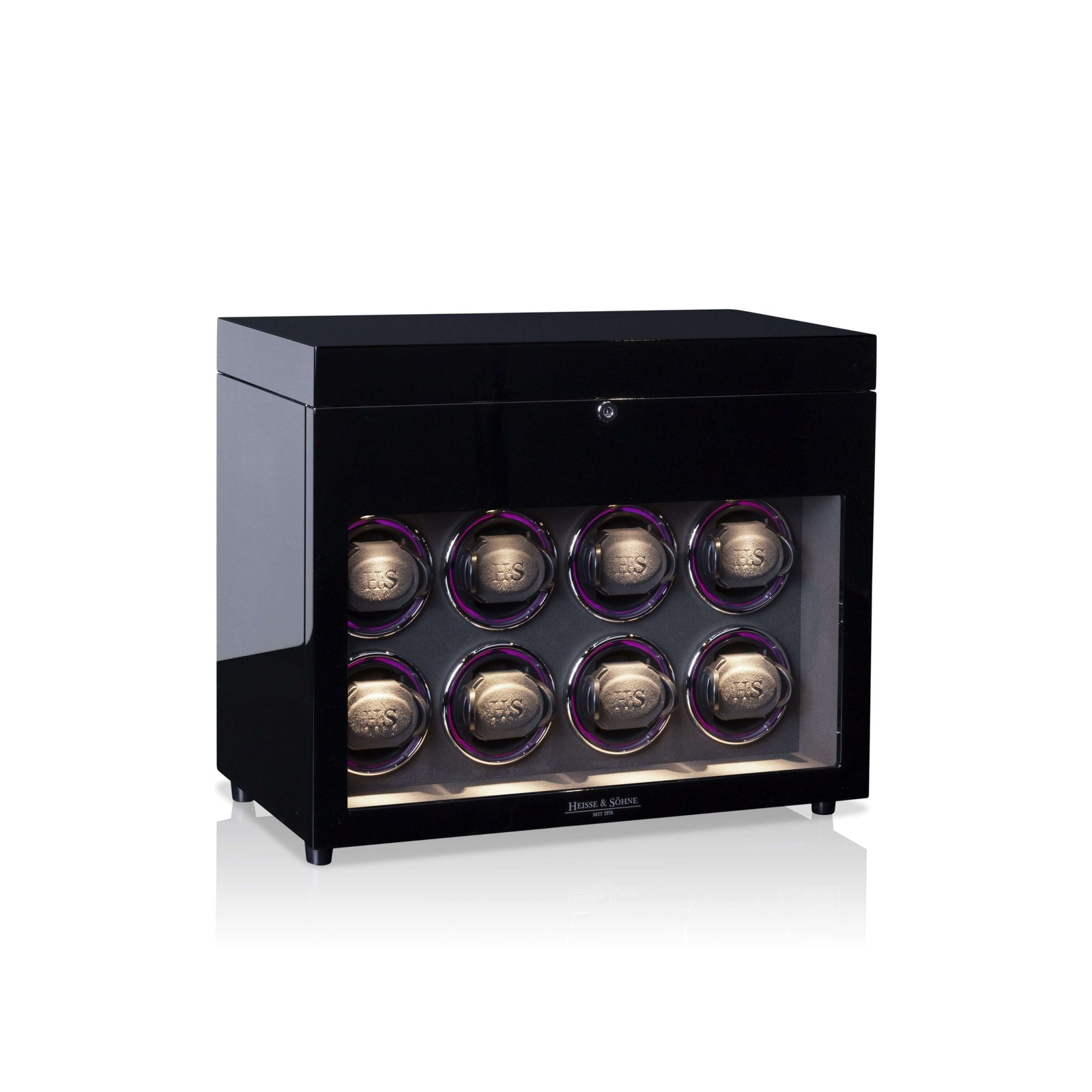 Black watch winder with six watches on a white background