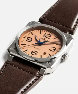 Watch with brown leather strap and beige dial on a white background
Bell & Ross BR-03 Copper BR03A-GB-ST/SCA Bandiera Jewellers