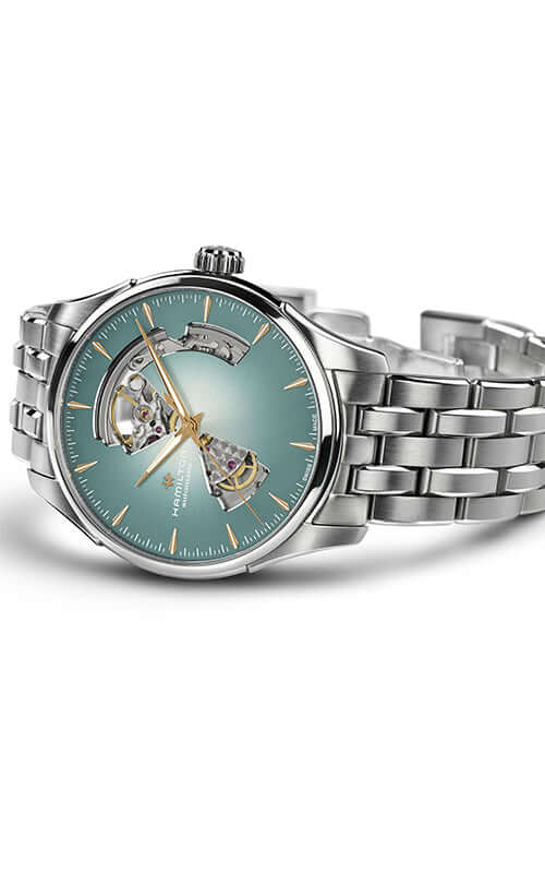 Silver wristwatch with a detailed face on a white background
Hamilton Jazzmaster Open Heart H32675141 Bandiera Jewellers