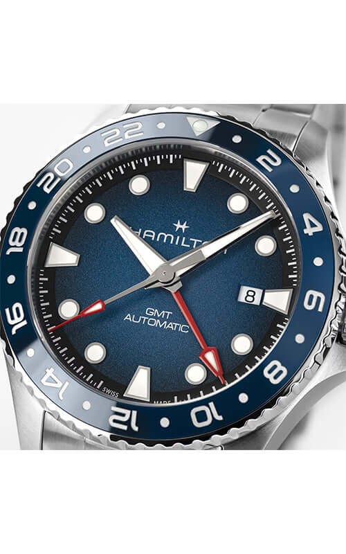 Hamilton watch with blue and silver design on a white background
Hamilton Khaki Navy Scuba GMT H82535140 / Bandiera Jewellers