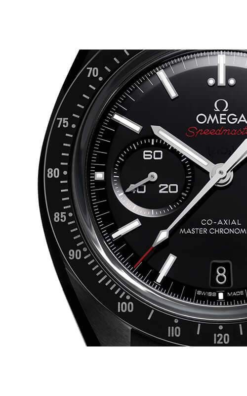 Close-up of a black Omega Speedmaster watch face with white markings.
Omega Speedmaster Dark Side of the Moon 310.92.44.51.01.004 Bandiera Jewellers