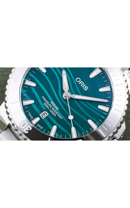 Oris watch with green face and silver case on a white background
Oris Yangtze Jiangtun Limited Edition 01 733 7789 4197-Set Bandiera Jewellers