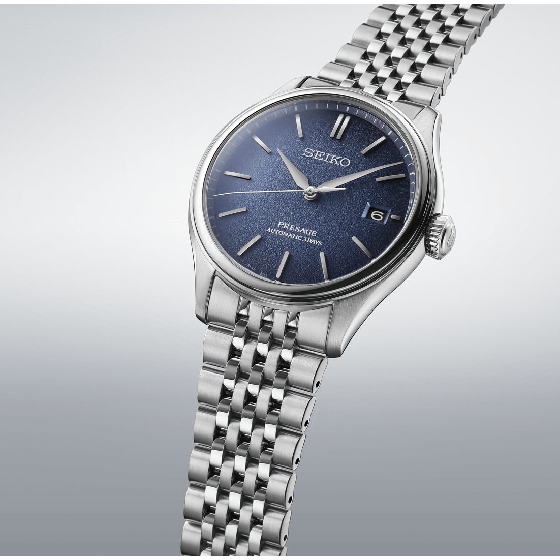 Silver Seiko watch with blue dial on a light gray background
Seiko Presage Classic Series SPB525J1 Bandiera Jewellers