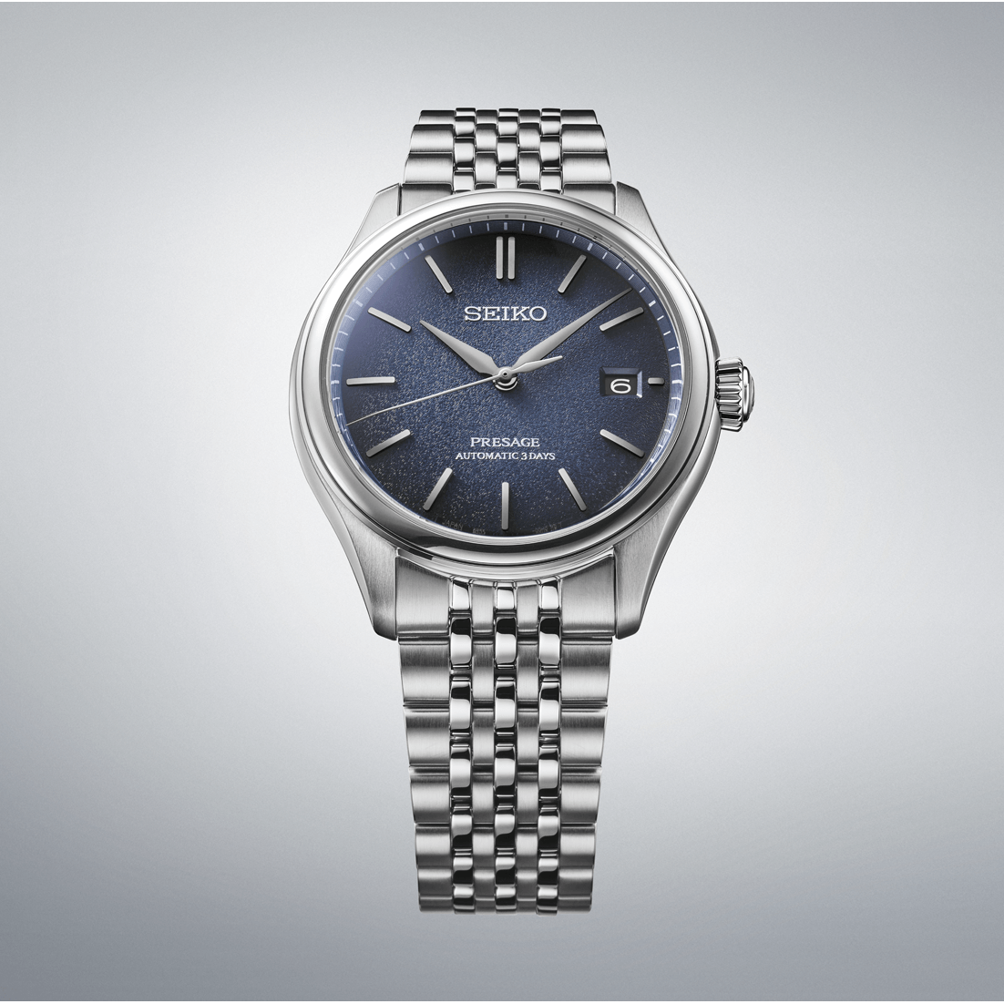 Silver Seiko watch with blue dial on a gray background
Seiko Presage Classic Series SPB525J1 Bandiera Jewellers