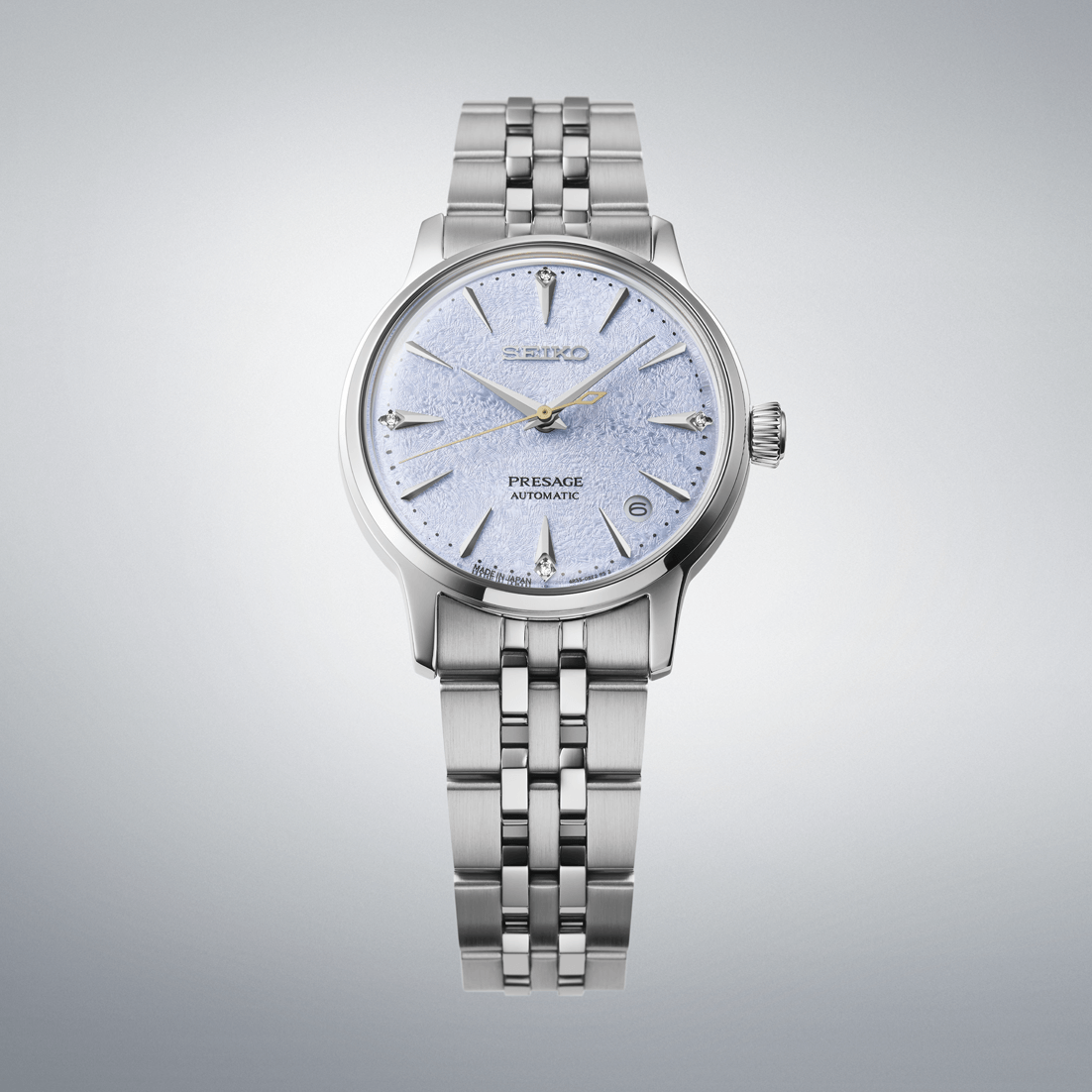 Silver Seiko watch on a light gray background
Seiko Presage "Cocktail Time" with Diamonds SRPL61J1 Bandiera Jewellers