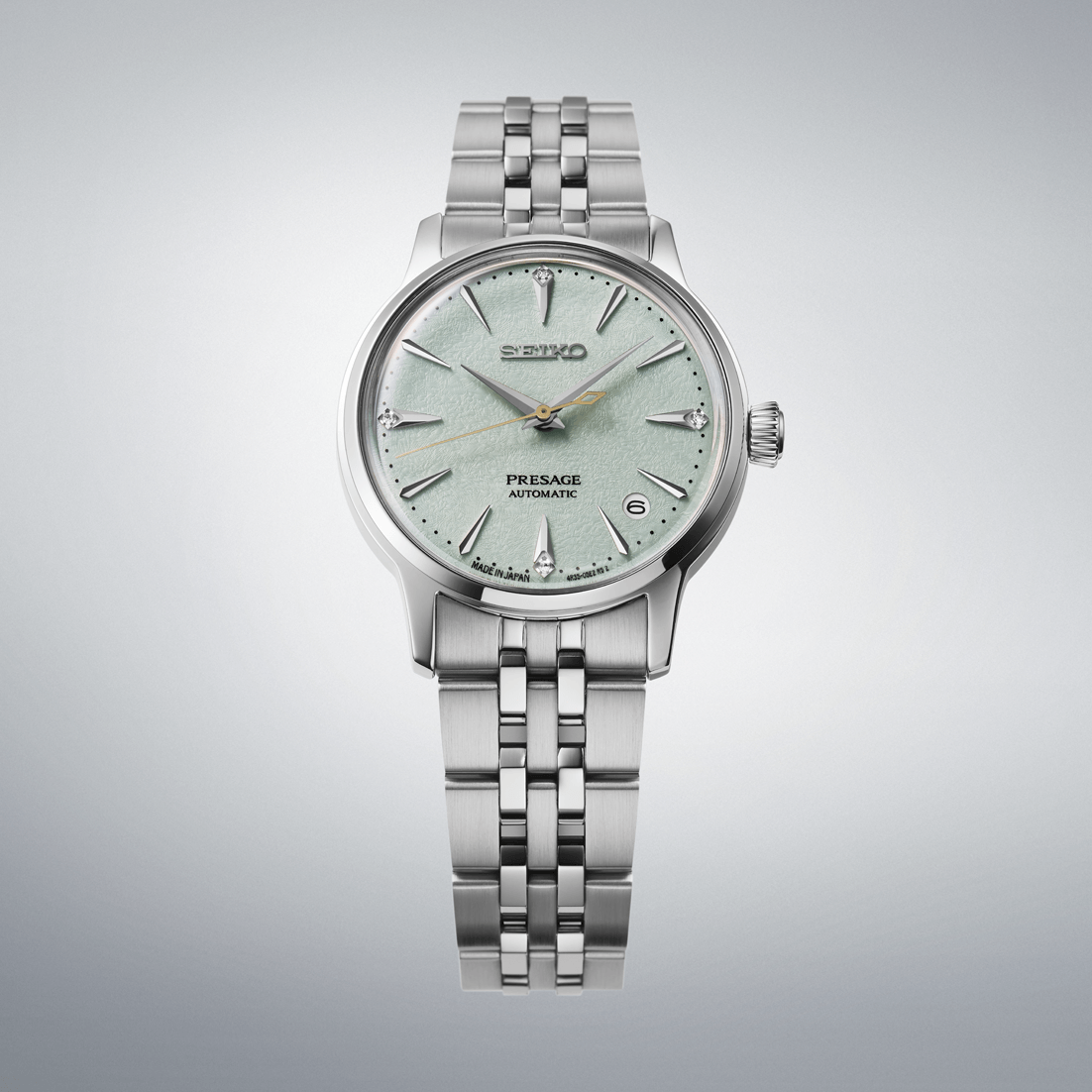 Silver watch with a light green face on a gray background
Seiko Presage "Cocktail Time" with Diamonds SRPL63J1 Bandiera Jewellers