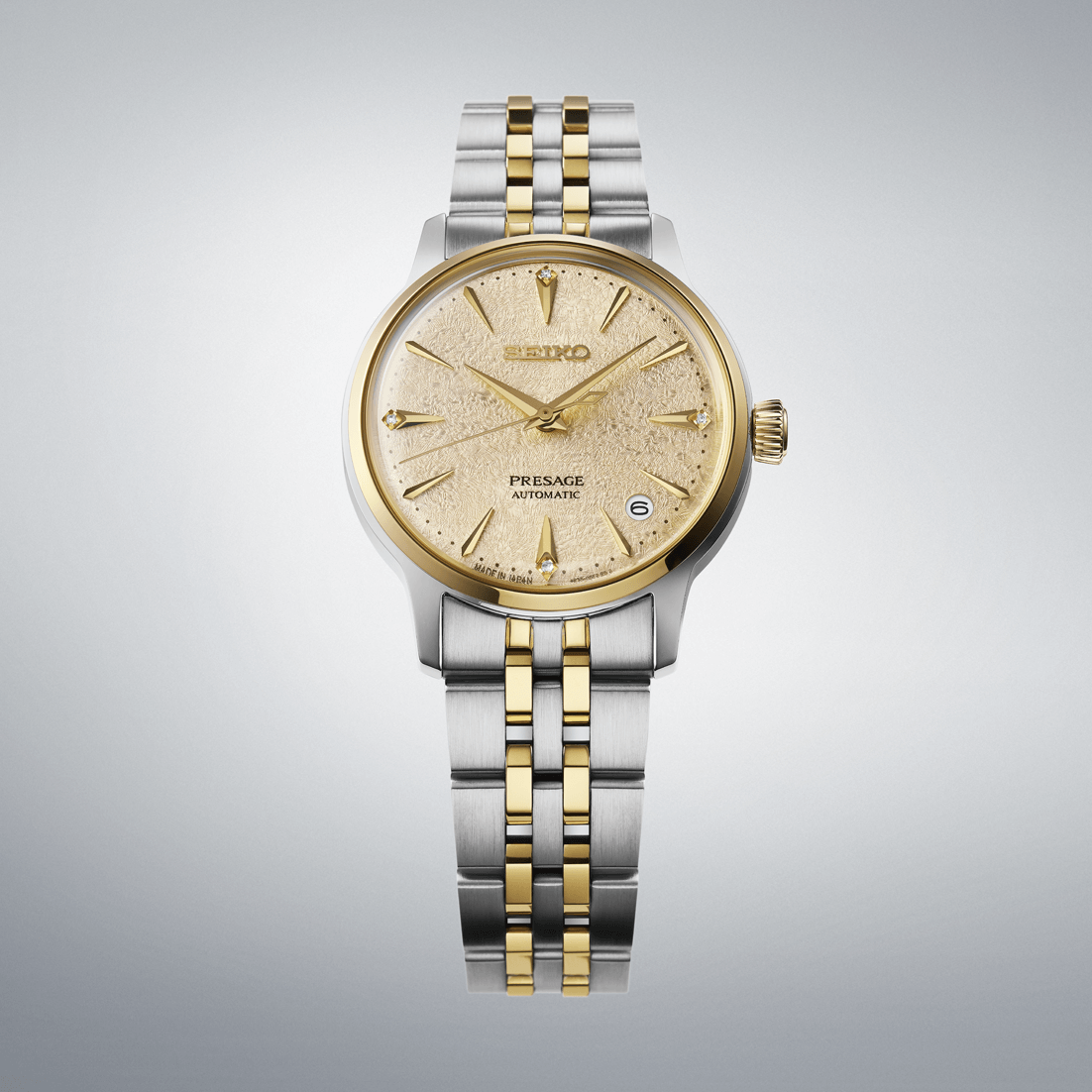 Two-tone Seiko watch with gold and silver band on a light gray background
Seiko Presage "Cocktail Time" with Diamonds SRPL64J1 Bandiera Jewellers