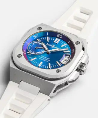 Watch with a blue face and white strap on a white background
Bell & Ross BR-X5 Iridescent BRX5R-IRS-ST/SRB Bandiera Jewellers