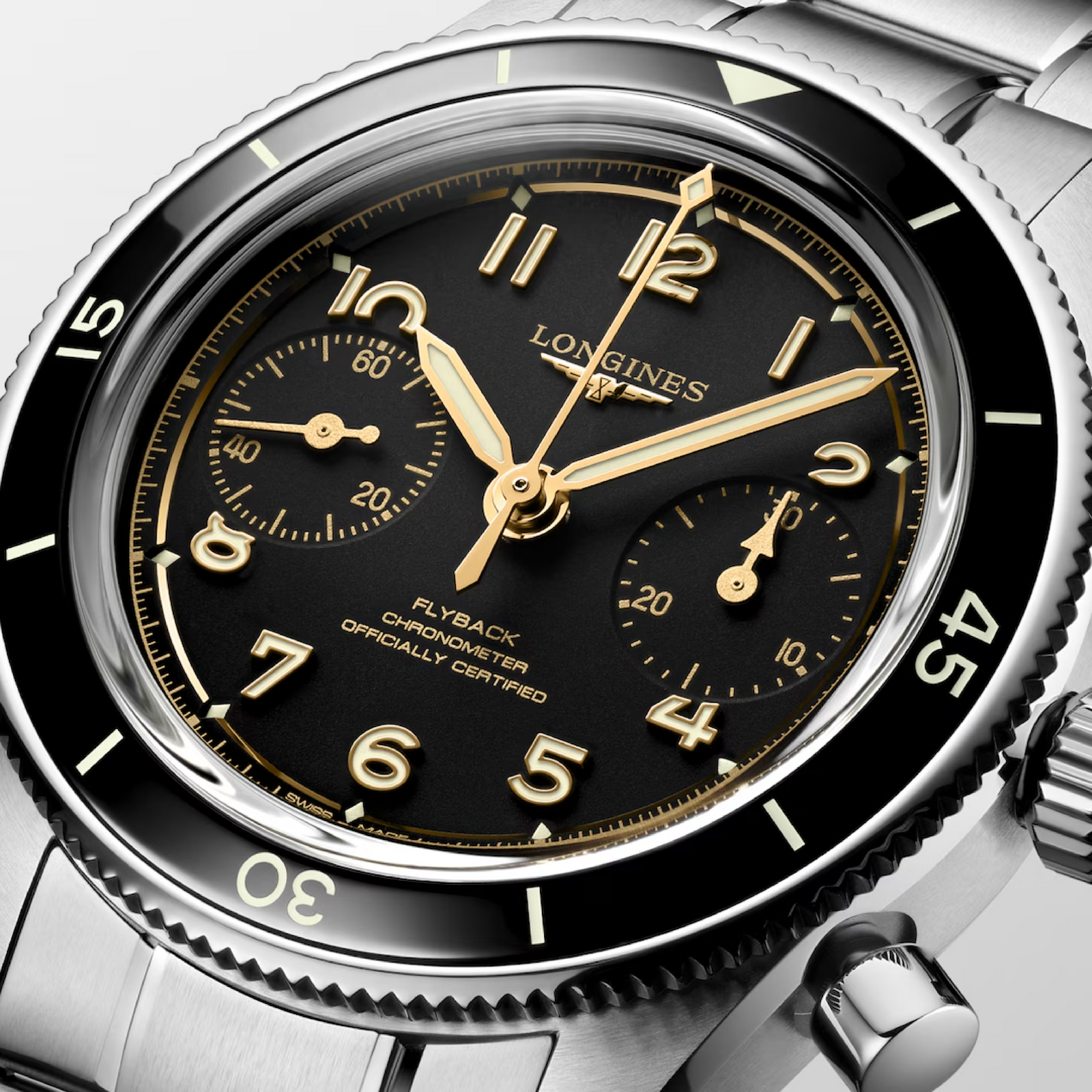 Longines watch with black dial and gold accents on a white background
Longines Spirit Pilot Flyback L37214536 Bandiera Jewellers