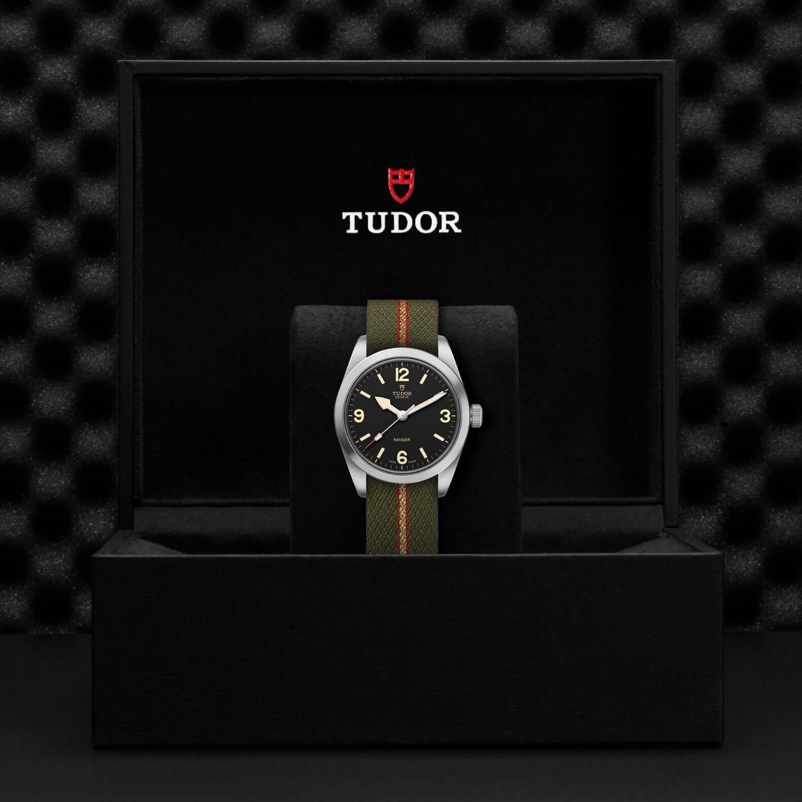 Tudor watch in a black display case with a checkered pattern
Tudor Ranger M79930-0003 Bandiera Jewellers