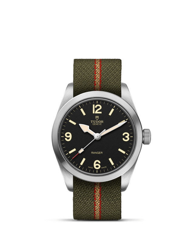 Tudor watch with green strap and black dial on a white background
Tudor Ranger M79930-0003 Bandiera Jewellers