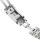 Close-up of a silver watch strap with 'PUSH' label on a black background
