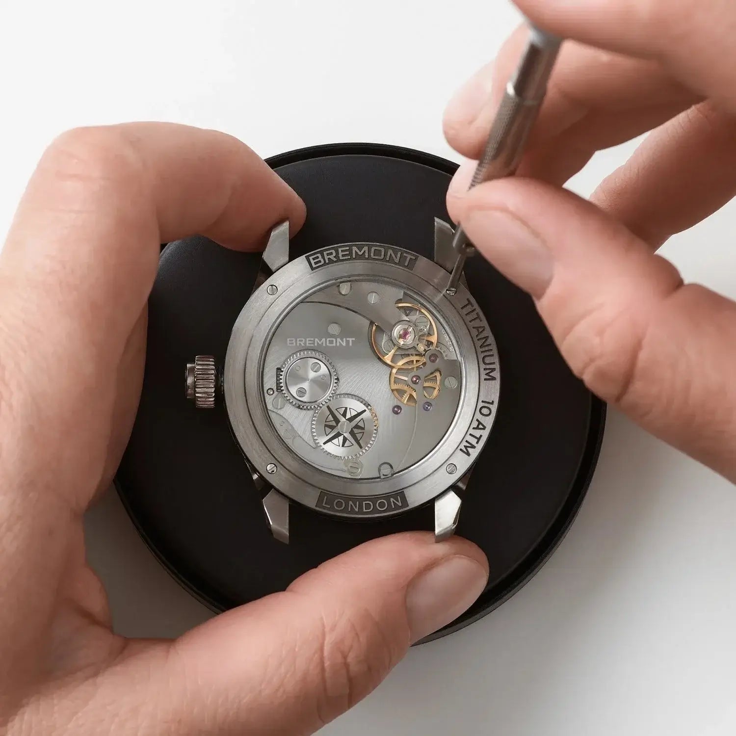 Person adjusting a Bremont watch with a tool on a white background
Bremont Altitude Skeletonised Perpetual Calendar GMT ALT42-PER-TI-BLSKL-B Bandiera Jewellers