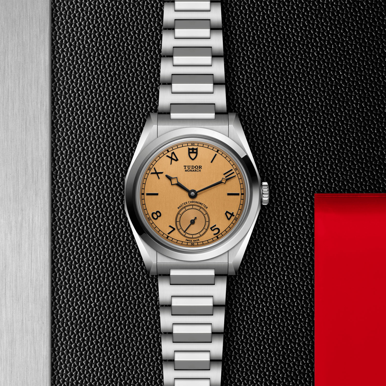 Silver watch with a brown face on a textured black background
Tudor Monarch M2639W1A0U-0001 Bandiera Jewellers