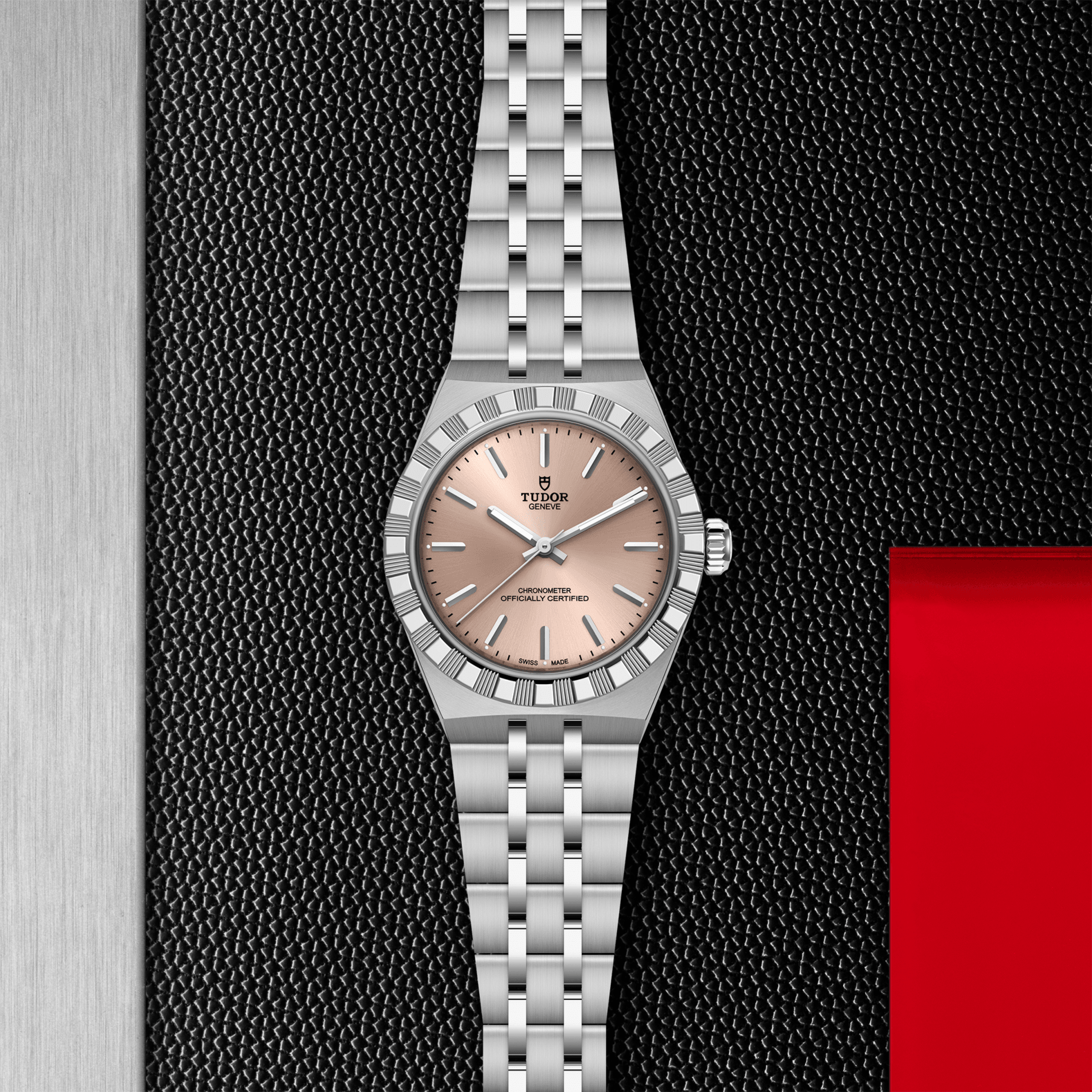 Silver watch with a pink face on a textured black background
Tudor Royal 30mm M2830A1A0-0003 Bandiera Jewellers