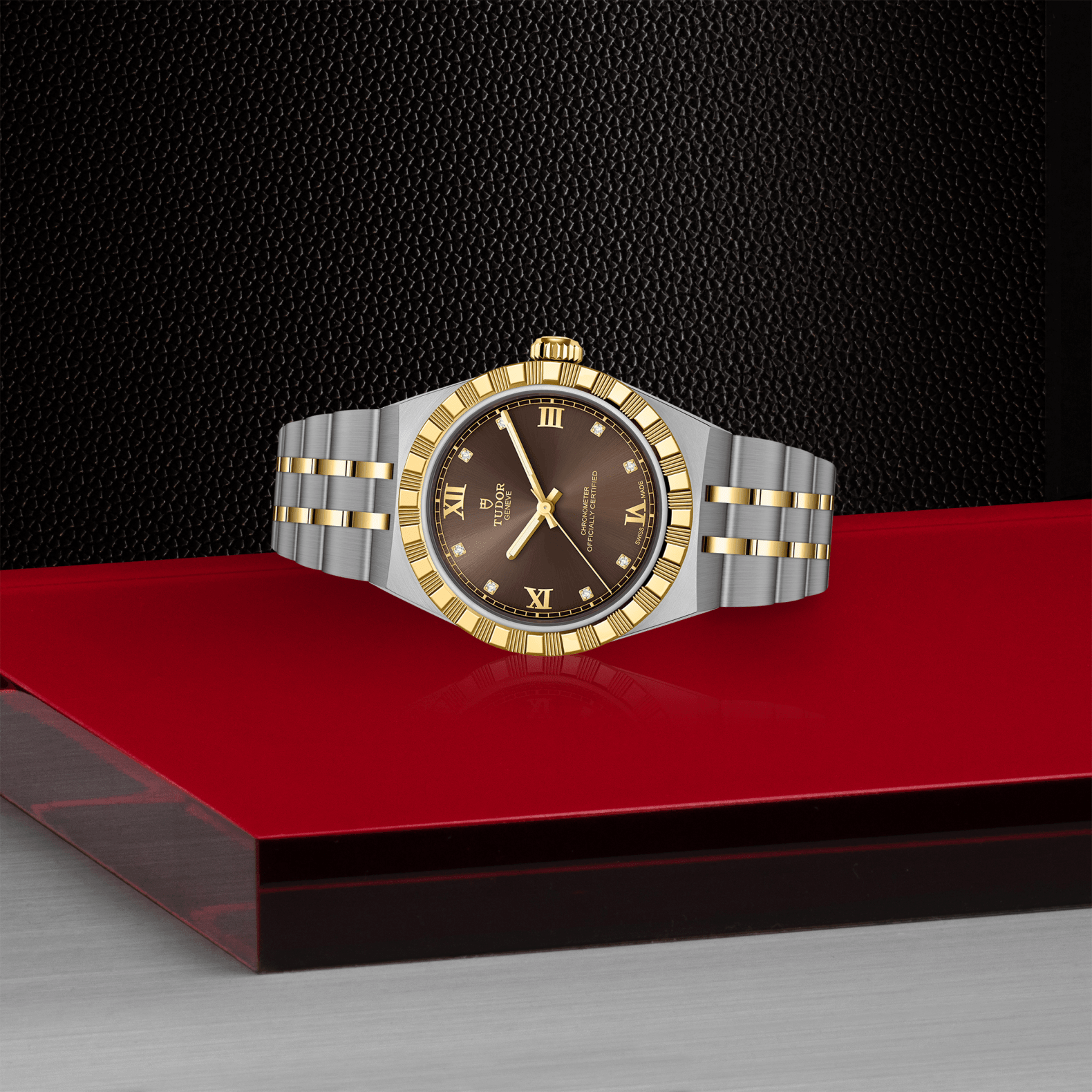 Luxury watch with a gold and silver band on a red platform against a black background
Tudor Royal 30mm M2830A1A3-0001 Bandiera Jewellers