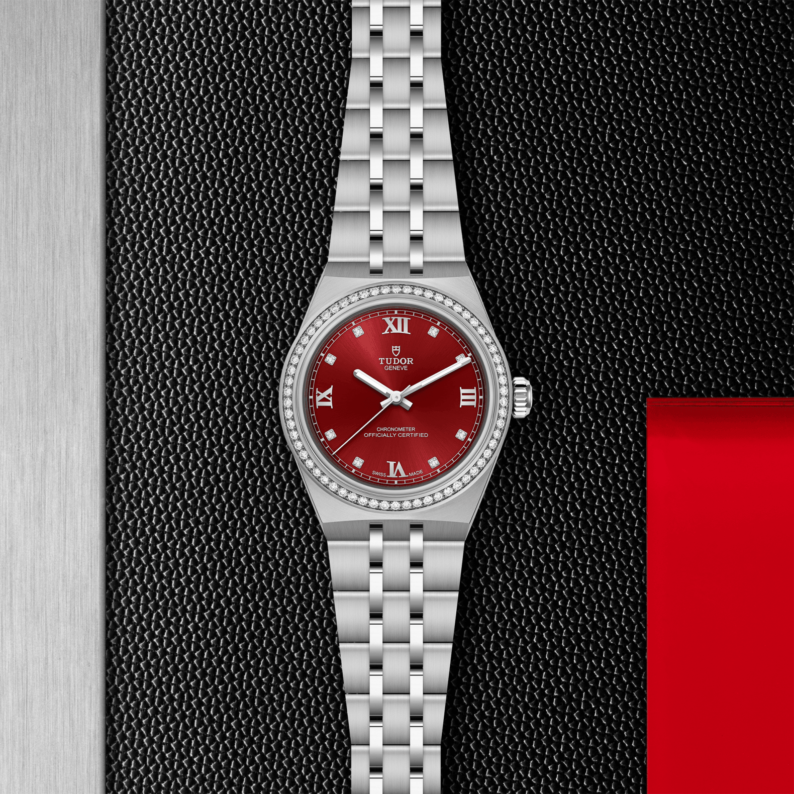 Silver watch with a red face on a textured black and gray background
Tudor Royal 30mm M2830A1S0-0002 Bandiera Jewellers