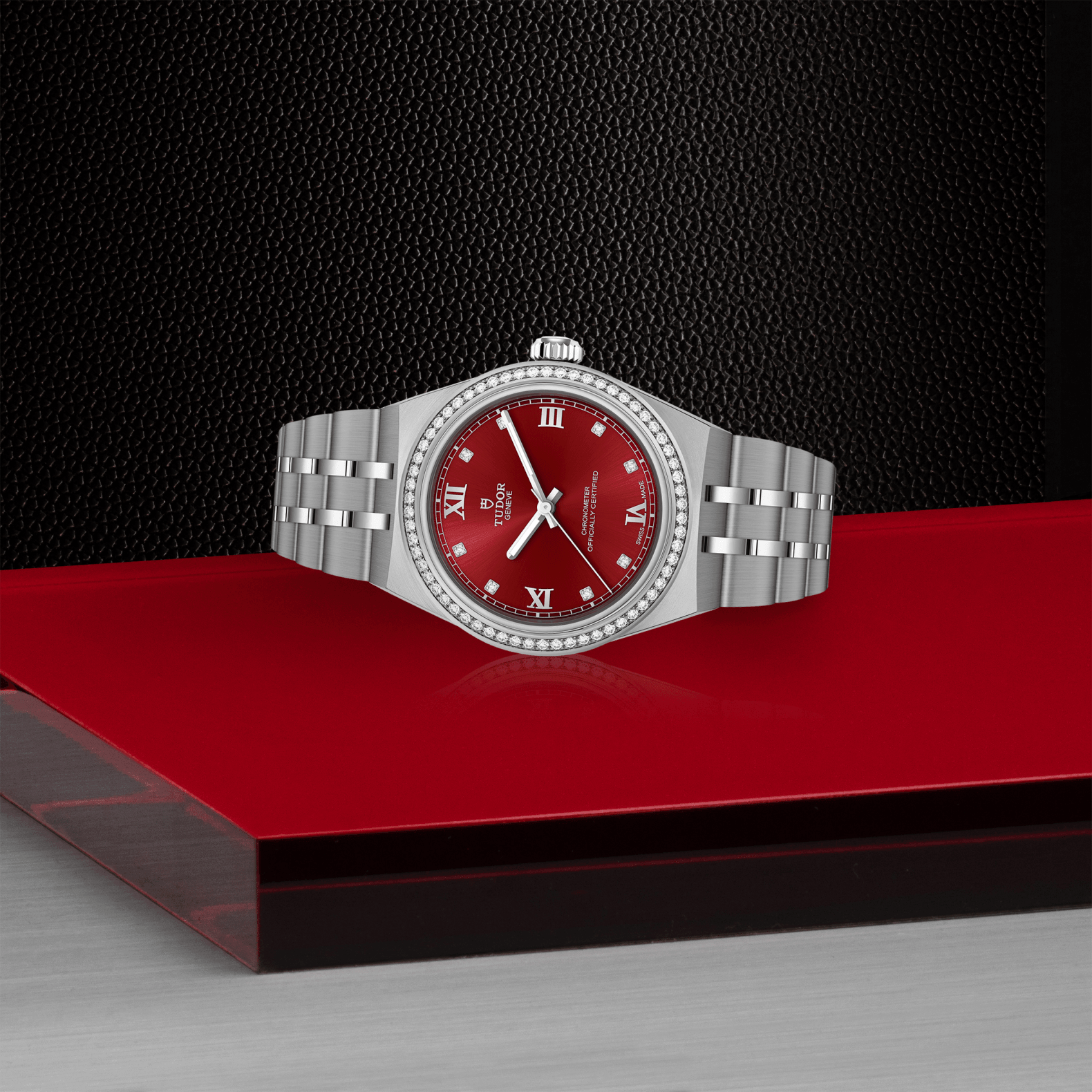 Silver watch with a red face on a black and red platform
Tudor Royal 30mm M2830A1S0-0002 Bandiera Jewellers