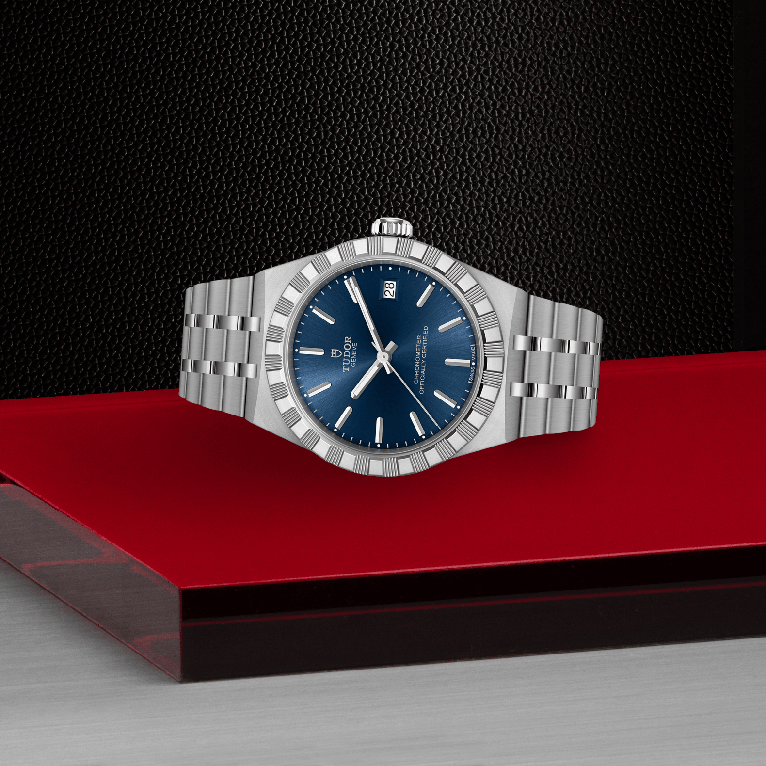 Silver watch with a blue face on a red platform against a black background
Tudor Royal 36mm m2836c1a0-0102 Bandiera Jewellers