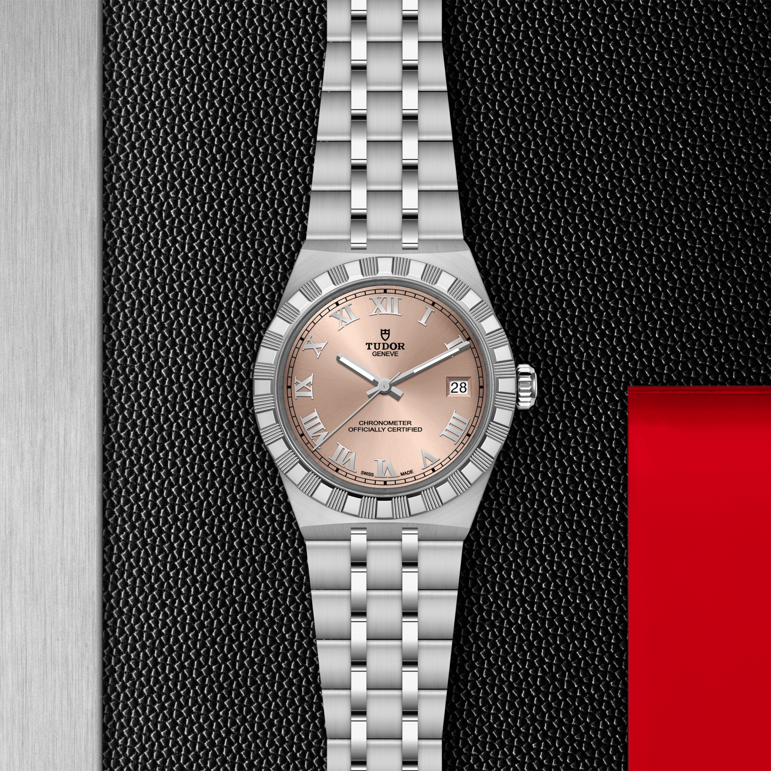 Silver watch with a pink face on a textured black and red background
TUDOR Royal 36mm M2836C1A0-0105 Bandiera Jewellers