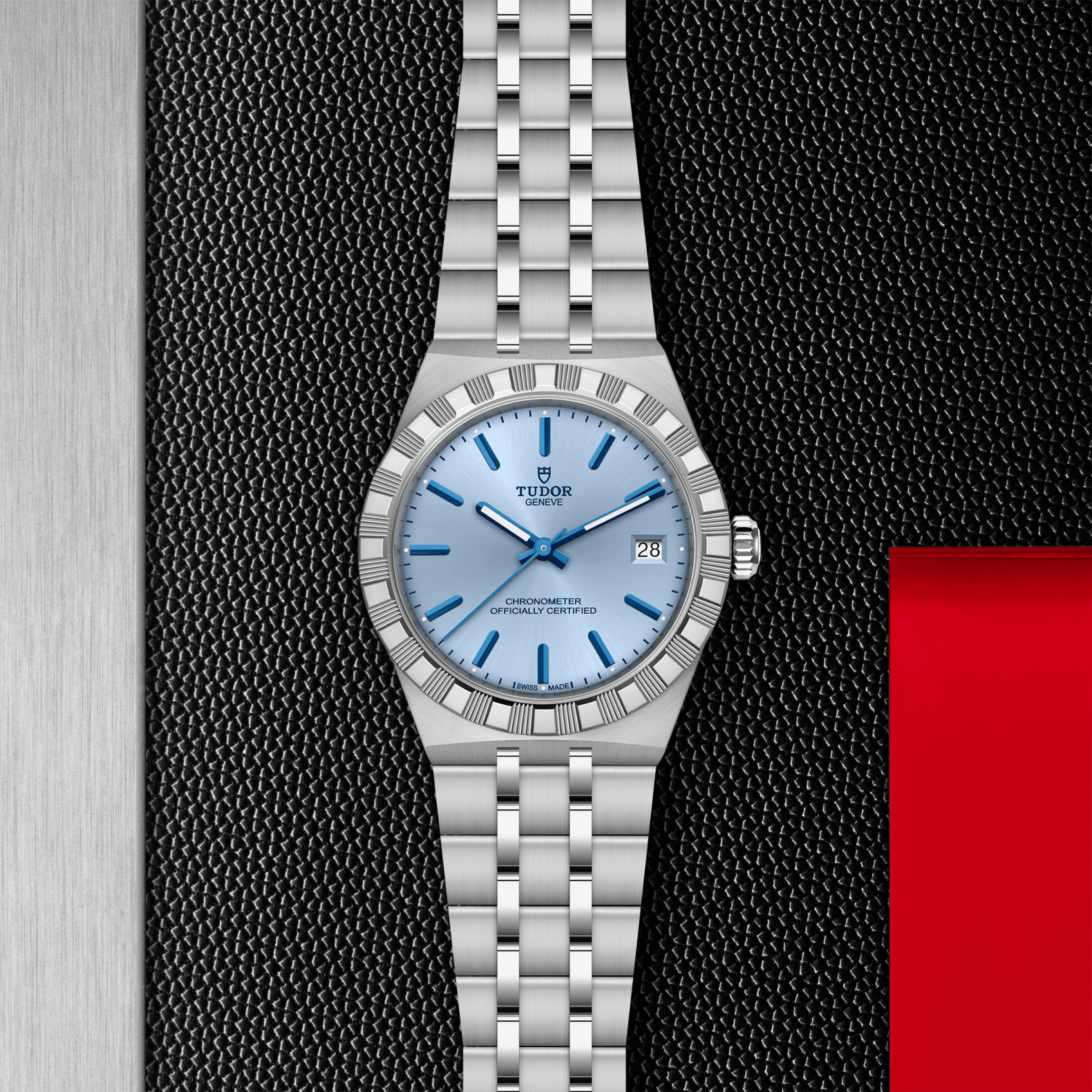 Silver watch with blue face on a textured black and red background
TUDOR Royal 36mm M2836C1A0-0106 Bandiera Jewellers