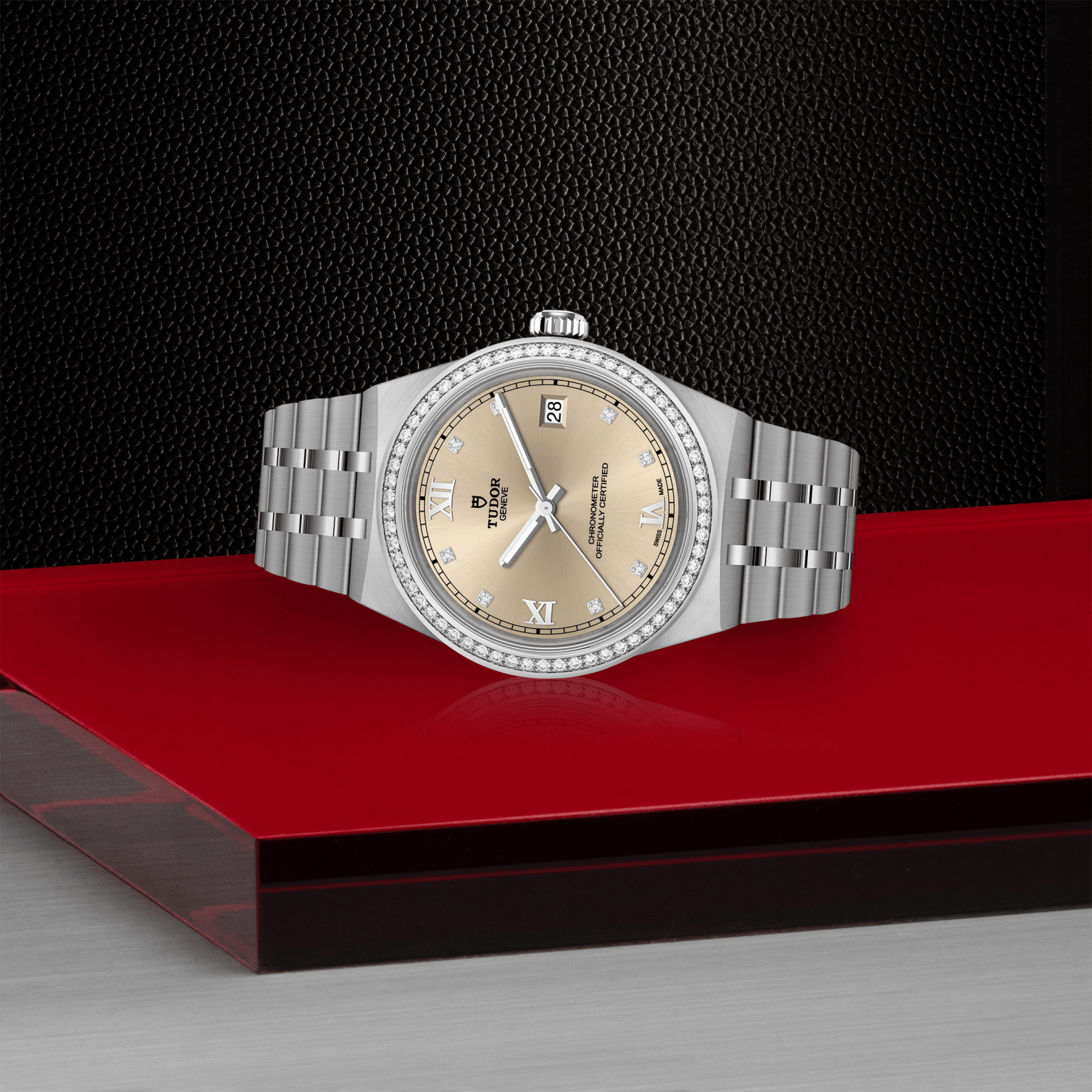 Silver watch with beige dial on a red platform against a black background
Tudor Royal 36 M2836C1S0-0001 Bandiera Jewellers