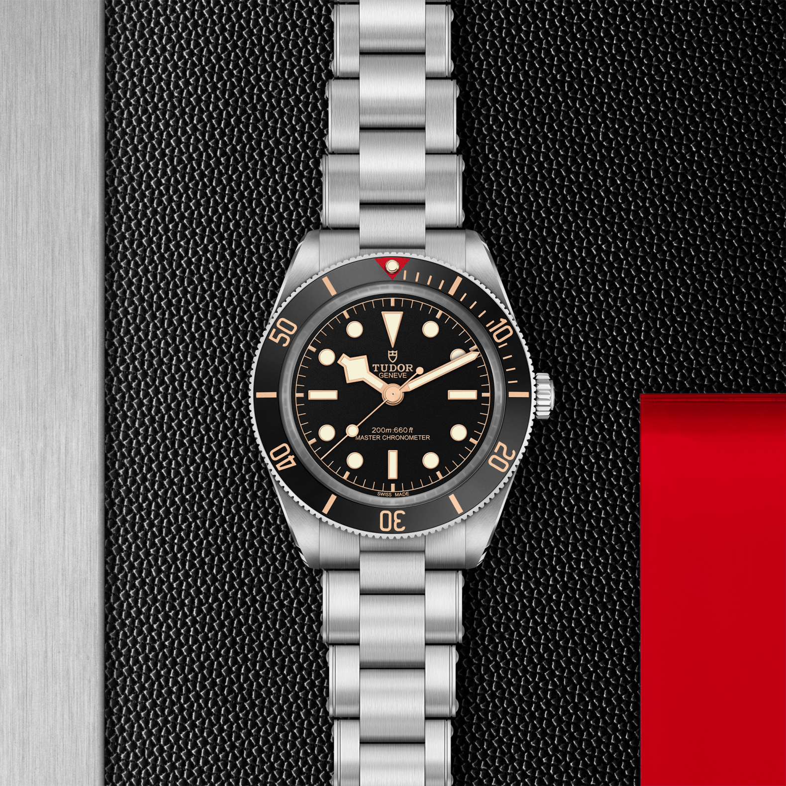 Silver watch with black dial on a textured black background
Tudor Black Bay 58 M7939A1A0NU-0002 Bandiera Jewellers