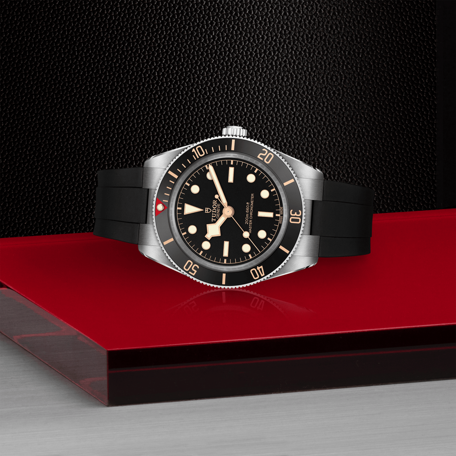 Watch with black strap and silver case on a red platform against a dark background
Tudor Black Bay 58 M7939A1A0NU-0003 Bandiera Jewellers