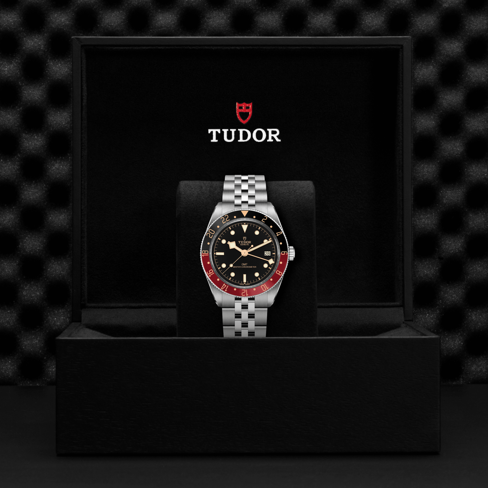 Tudor watch in a black display case with a textured black background
Tudor Black Bay 58 GMT M7939G1A0NRU-0003 Bandiera Jewellers
