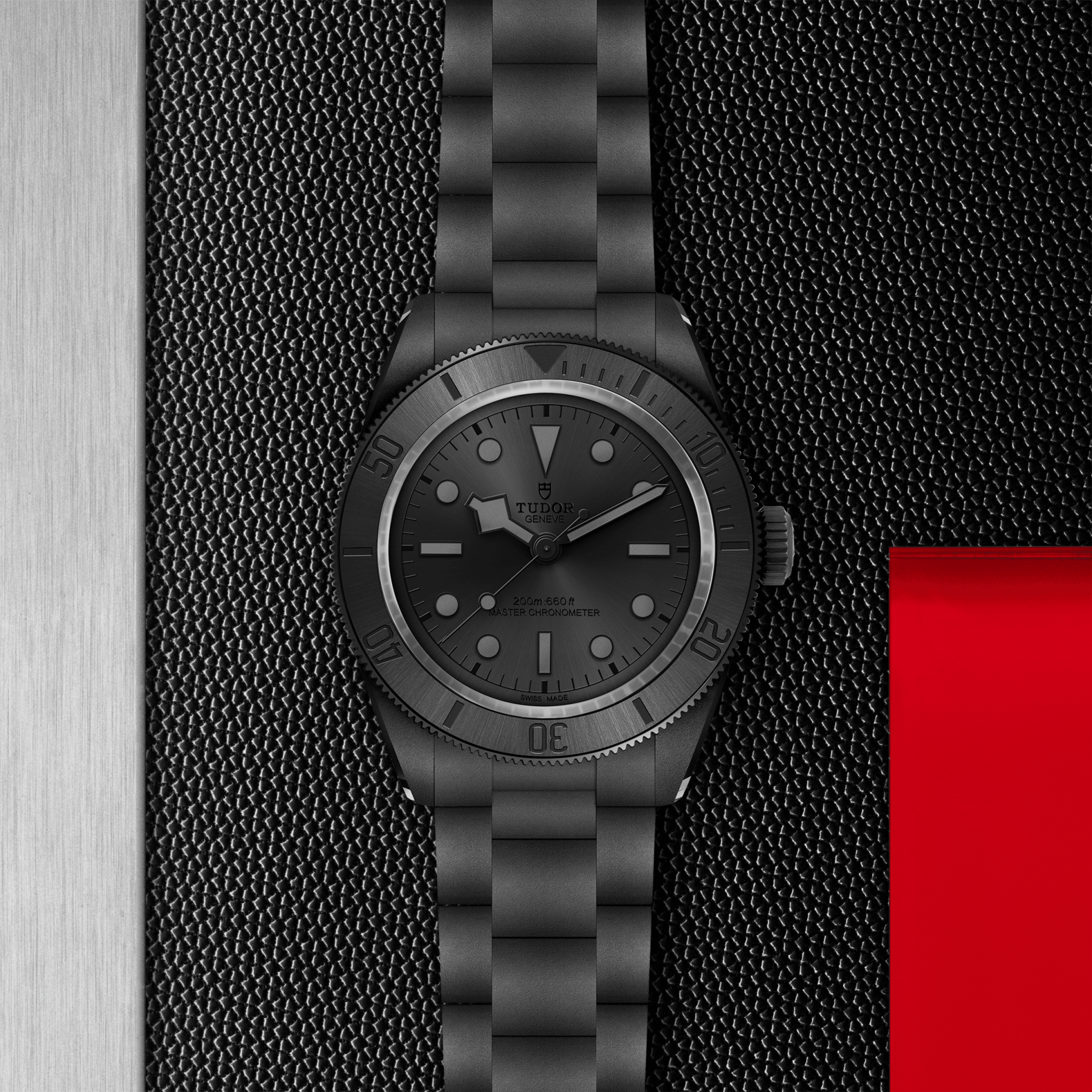 Black watch with a textured strap on a black textured background
Tudor Black Bay Ceramic M7941A1ACNU-0001 Bandiera Jewellers