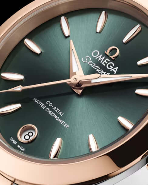Omega watch with green face and rose gold accents