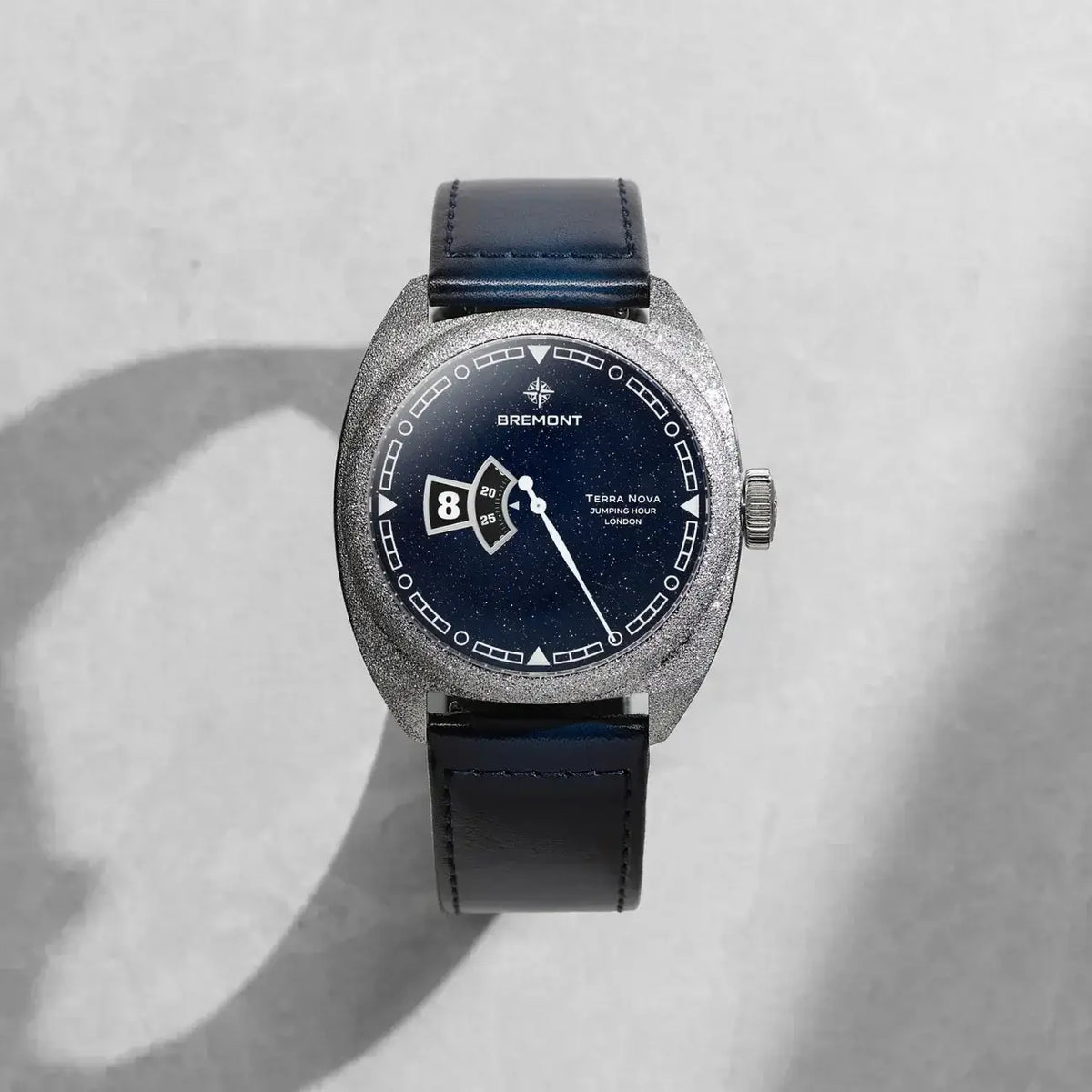 Wristwatch with black strap and blue dial on a light gray background

Bremont Terra Nova Jumping Hour Aventurine TN40-JH-FS-BLAV-L-S Bandiera Jewellers