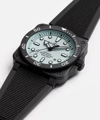 Black wristwatch with a greenish-blue dial on a white background

Bell & Ross BR-03 Diver Full Lum Ceramic BR03A-D-LM-CE/SRB Bandiera Jewellers