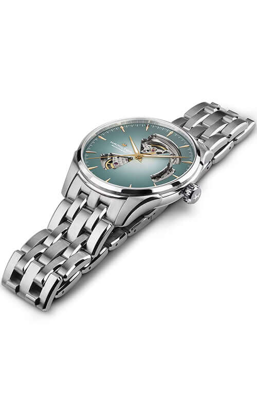 Silver watch with a detailed face on a white background

Hamilton Jazzmaster Open Heart H32675141 Bandiera Jewellers