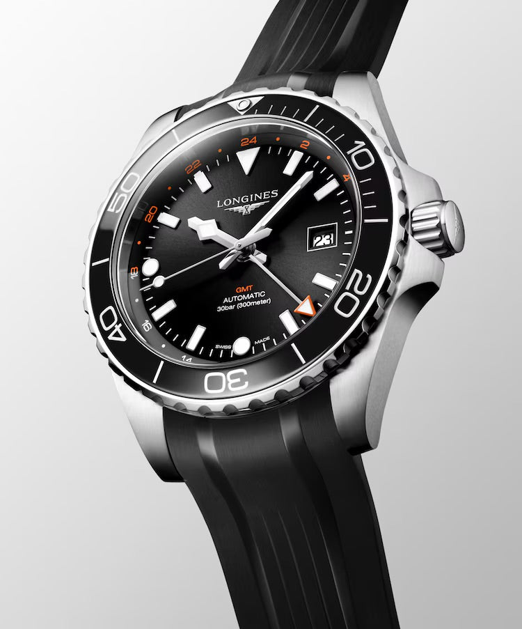 Longines watch with black dial and rubber strap on a white background

Longines HydroConquest GMT L38904569 | Bandiera Jewellers