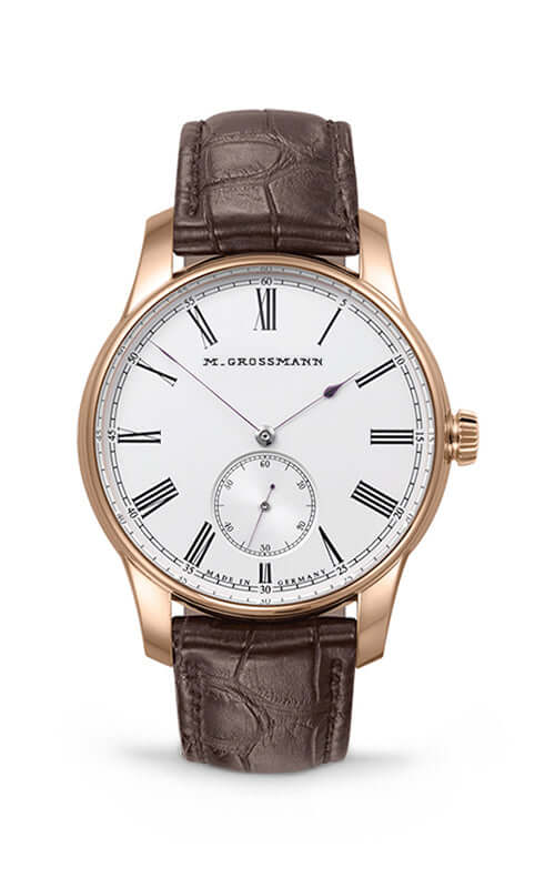 Luxury watch with brown leather strap and white dial on a white background

Moritz Grossmann Hamatic Vintage Rose Gold MG-003535 Bandiera Jewellers