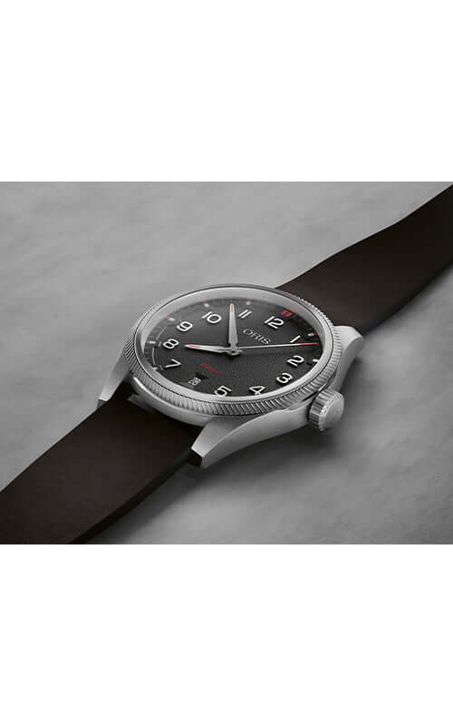 Wristwatch with black strap and dark face on a gray surface

ORIS ProPilot Date 01 733 7805 4164-07 6 20 14LC Bandiera Jewellers