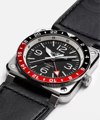 Watch with black leather strap and red accents on a white background

Bell & Ross BR-03 GMT Black BR0393-BL-ST/SCA Bandiera Jewellers