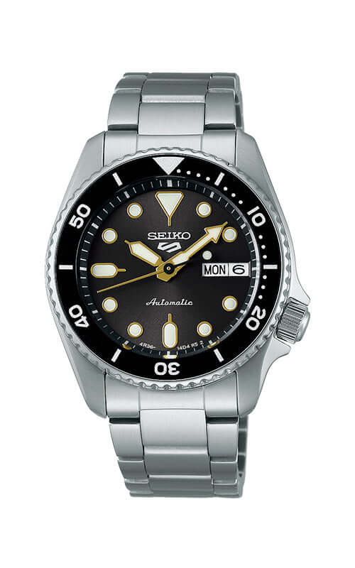Seiko watch with black dial and silver metal bracelet on a white background

Seiko 5 Sports SKX Series SRPL79K1J Bandiera Jewellers