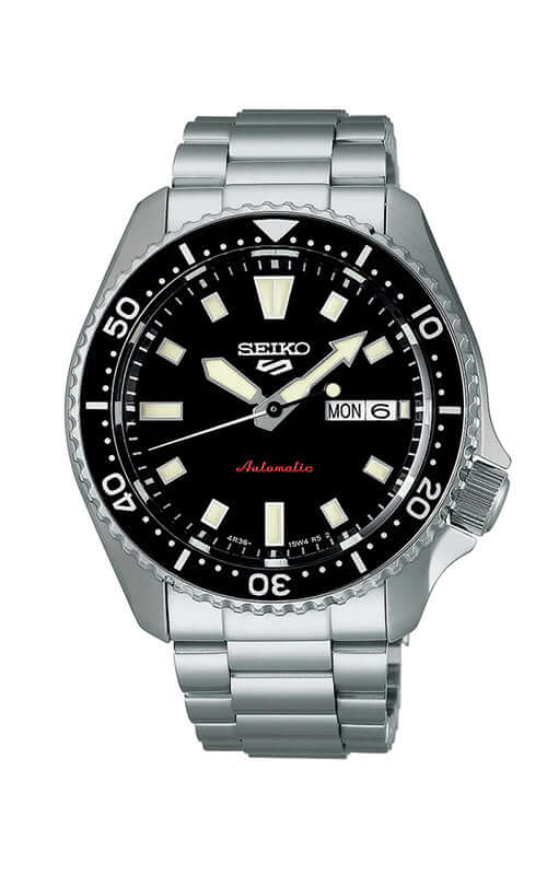 Seiko watch with black dial and silver metal strap on a white background

Seiko 5 Sports SKX Series SRPL85K1J Bandiera Jewellers