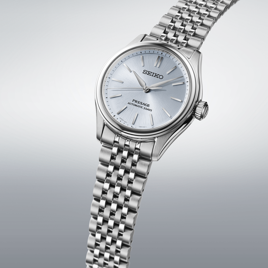 Silver Seiko watch with a metallic band on a light gray background

Seiko Presage Classic Series SPB521J1 Bandiera Jewellers