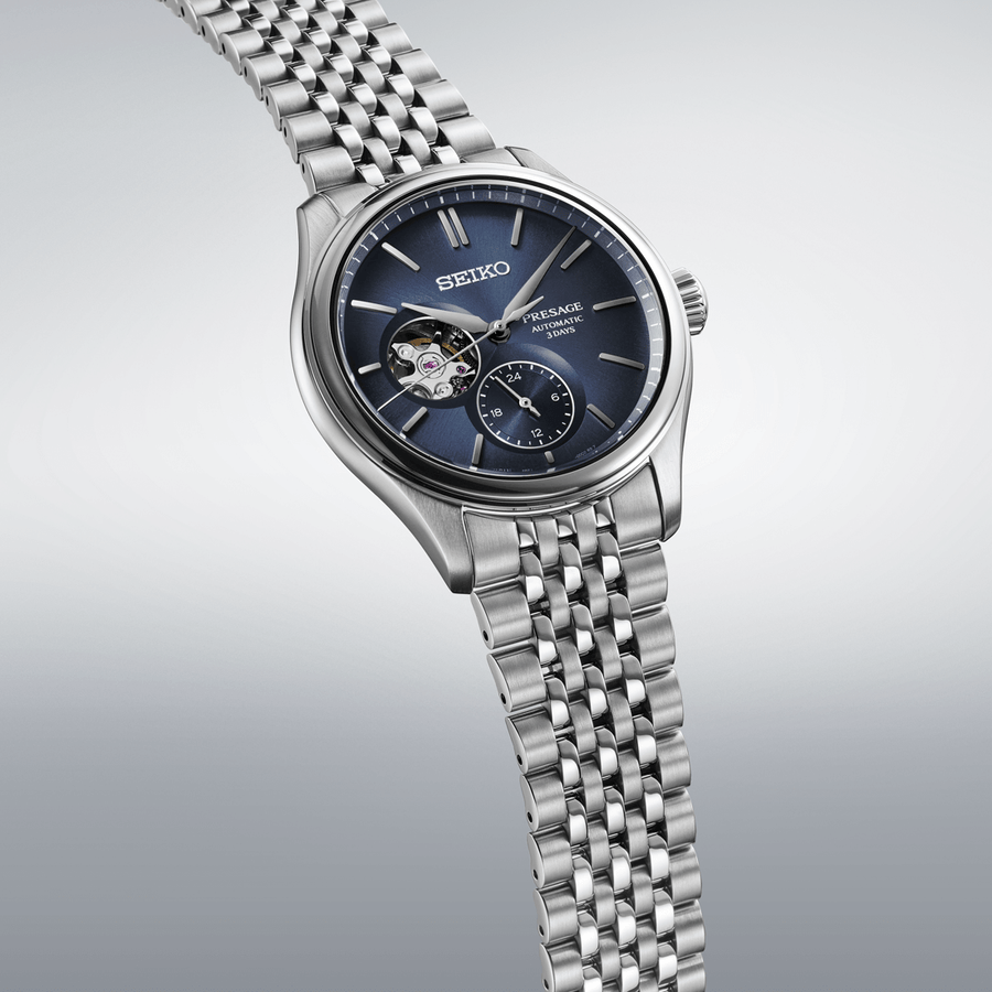 Seiko Presage watch with blue face and silver metal strap on a white background

Seiko Presage Classic Series SPB527J1 Bandiera Jewellers