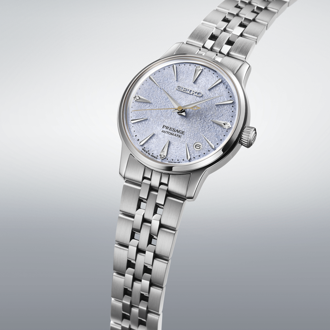 Silver Seiko watch with a detailed face on a light gray background

Seiko Presage "Cocktail Time" with Diamonds SRPL61J1 Bandiera Jewellers