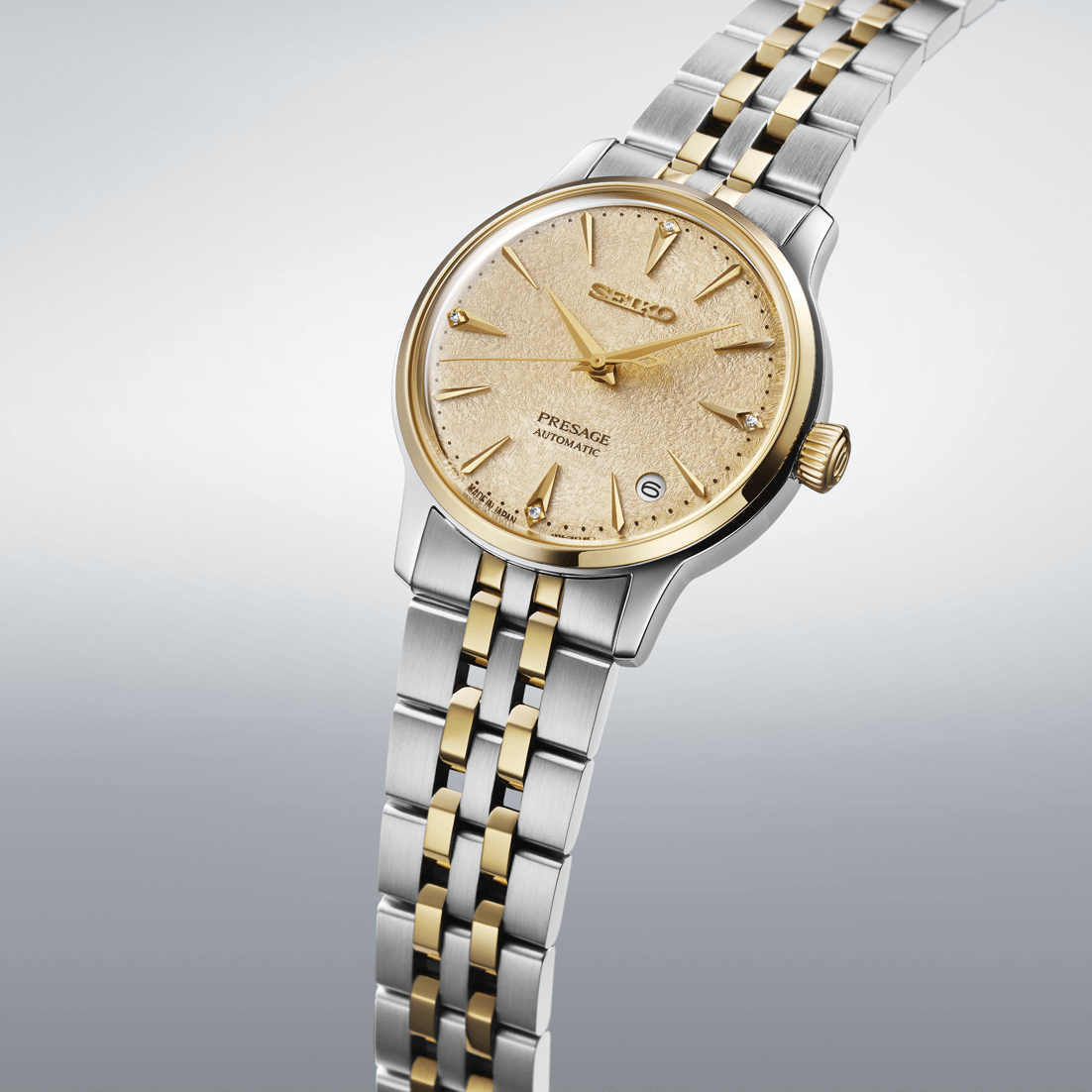 Two-tone watch with gold and silver bracelet on a light gray background

Seiko Presage "Cocktail Time" with Diamonds SRPL64J1 Bandiera Jewellers