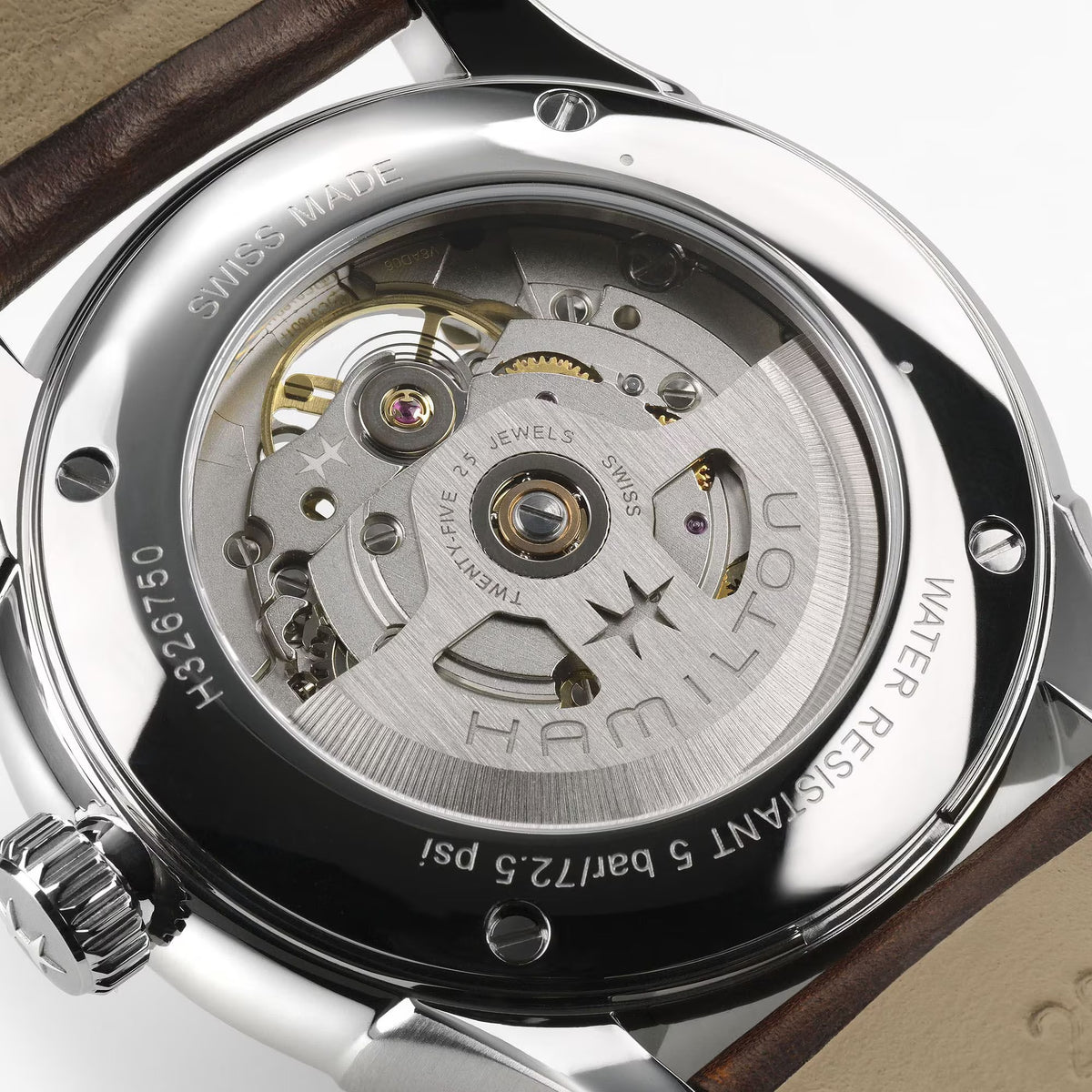 Close-up of a Hamilton watch mechanism with visible branding.

Hamilton Jazzmaster Open Heart Watch H32675501 Bandiera Jewellers