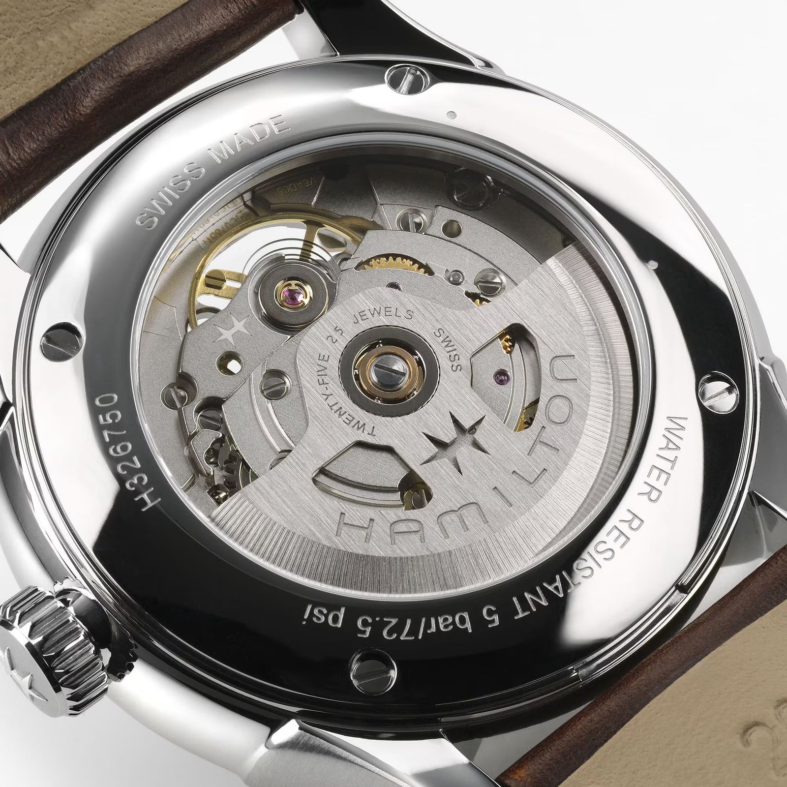 Close-up of a Hamilton watch mechanism with visible branding.

Hamilton Jazzmaster Open Heart Watch H32675501 Bandiera Jewellers