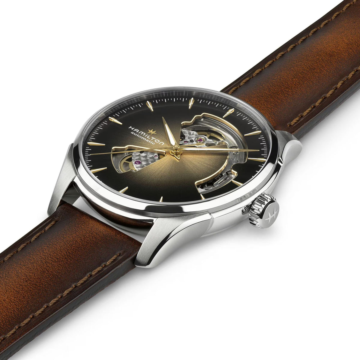 Watch with brown leather strap and black face on a white background

Hamilton Jazzmaster Open Heart Watch H32675501 Bandiera Jewellers