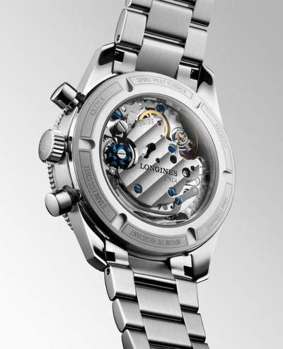 Silver Longines watch with open face design on a light gray background

Longines Spirit Pilot Flyback L37214536 Bandiera Jewellers