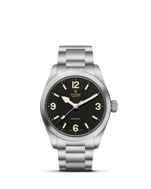 Silver watch with black dial on a white background

Tudor Ranger M79930-0001 Bandiera Jewellers