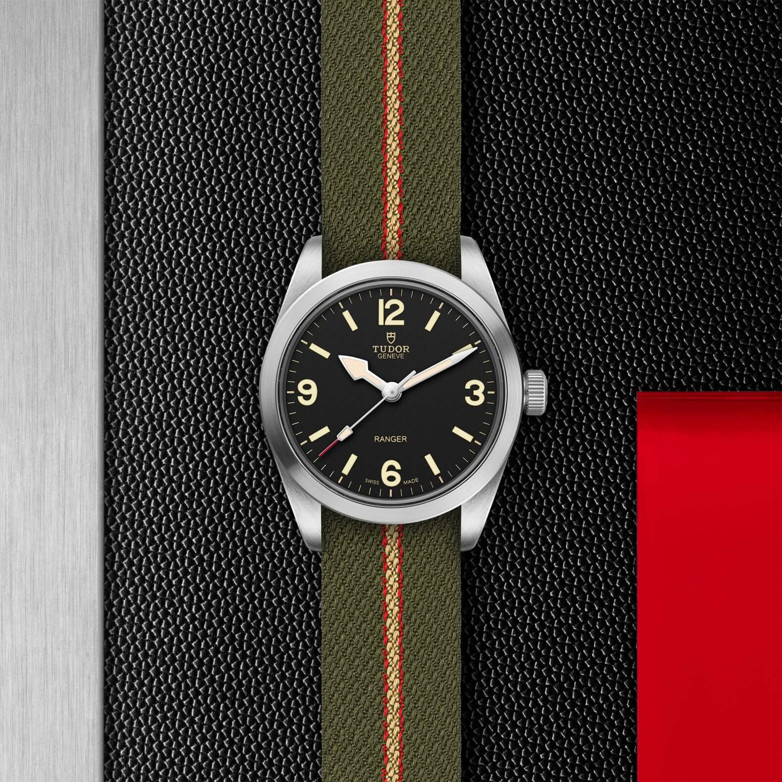 Tudor watch with green strap and black dial on a white background

Tudor Ranger M79930-0003 Bandiera Jewellers